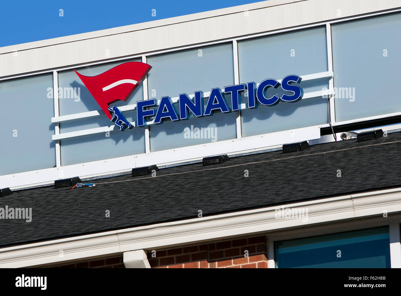 A logo sign outside of the headquarters of the parent company