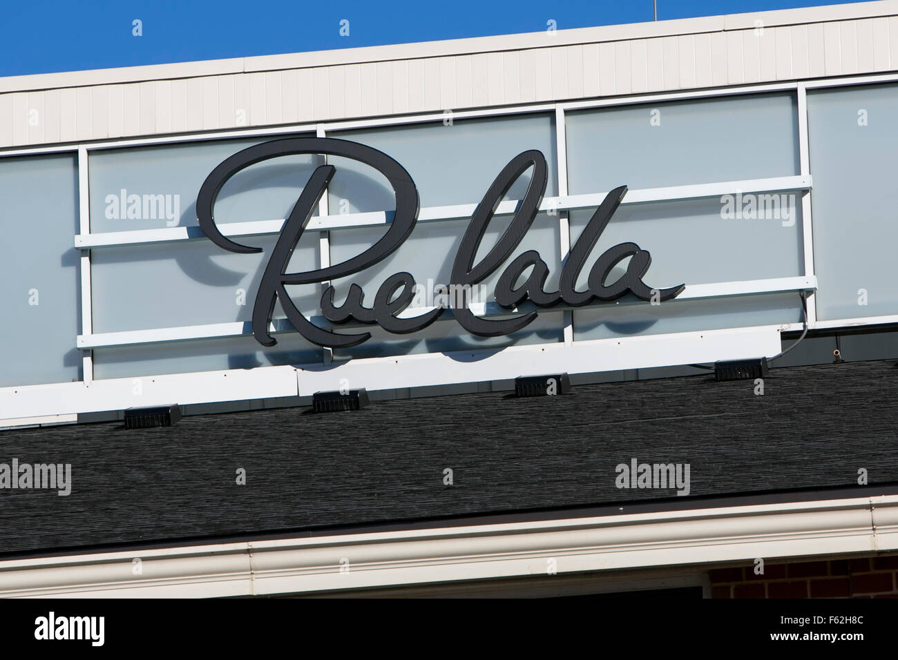 A logo sign outside of the headquarters of the parent company