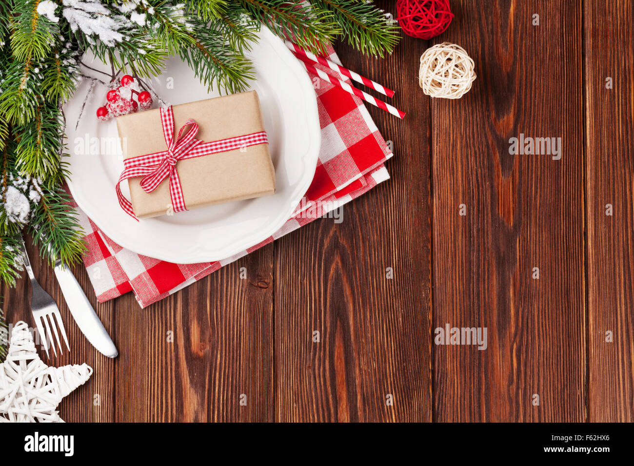 Christmas table setting with gift box and wooden table. Top view with copy Stock Photo - Alamy