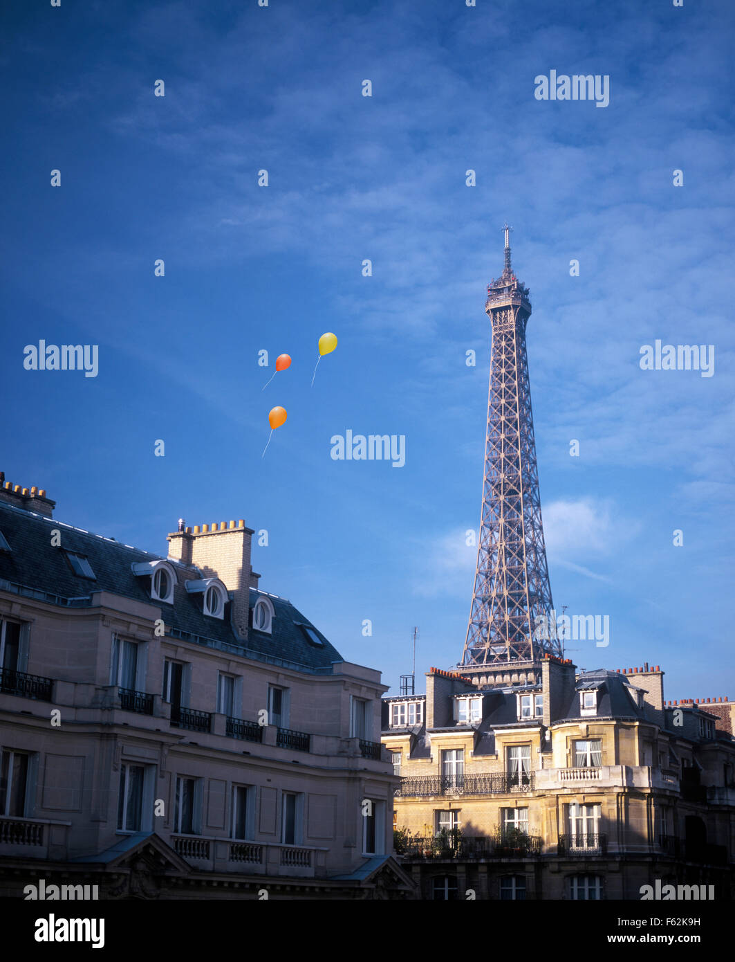 France, Paris, Balloons Floating By Eiffel Tower Stock Photo