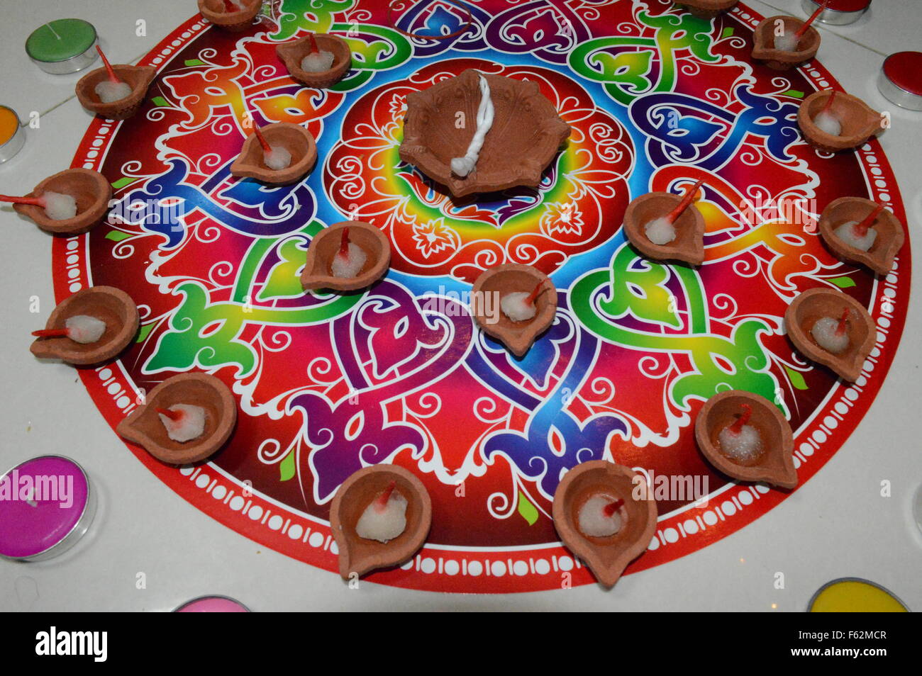 Multicolor rangoli with diya and diwali hindu festival in singapore Stock Photo
