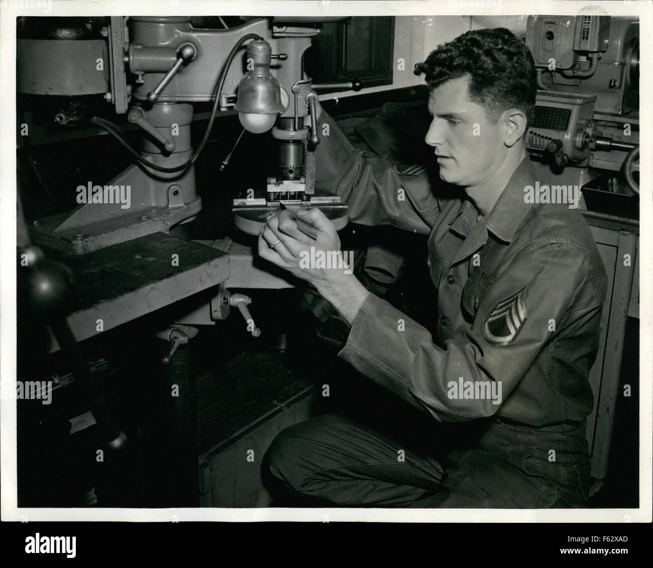 1957 - Sgt. John J. Smith works with one of his inventions which have been perfected while he served as a member of the 82d Airborne Division's 782d Ordnance Battalion. Sergent Smith, designer of more than a dozen devices now being used by the Ordnance Battalion where he works, operated a seal cutter. The apparatus can turn out 65 voltage regulate seals a minute. Previously two minutes were required for one man to cut a single seal. © Keystone Pictures USA/ZUMAPRESS.com/Alamy Live News Stock Photo