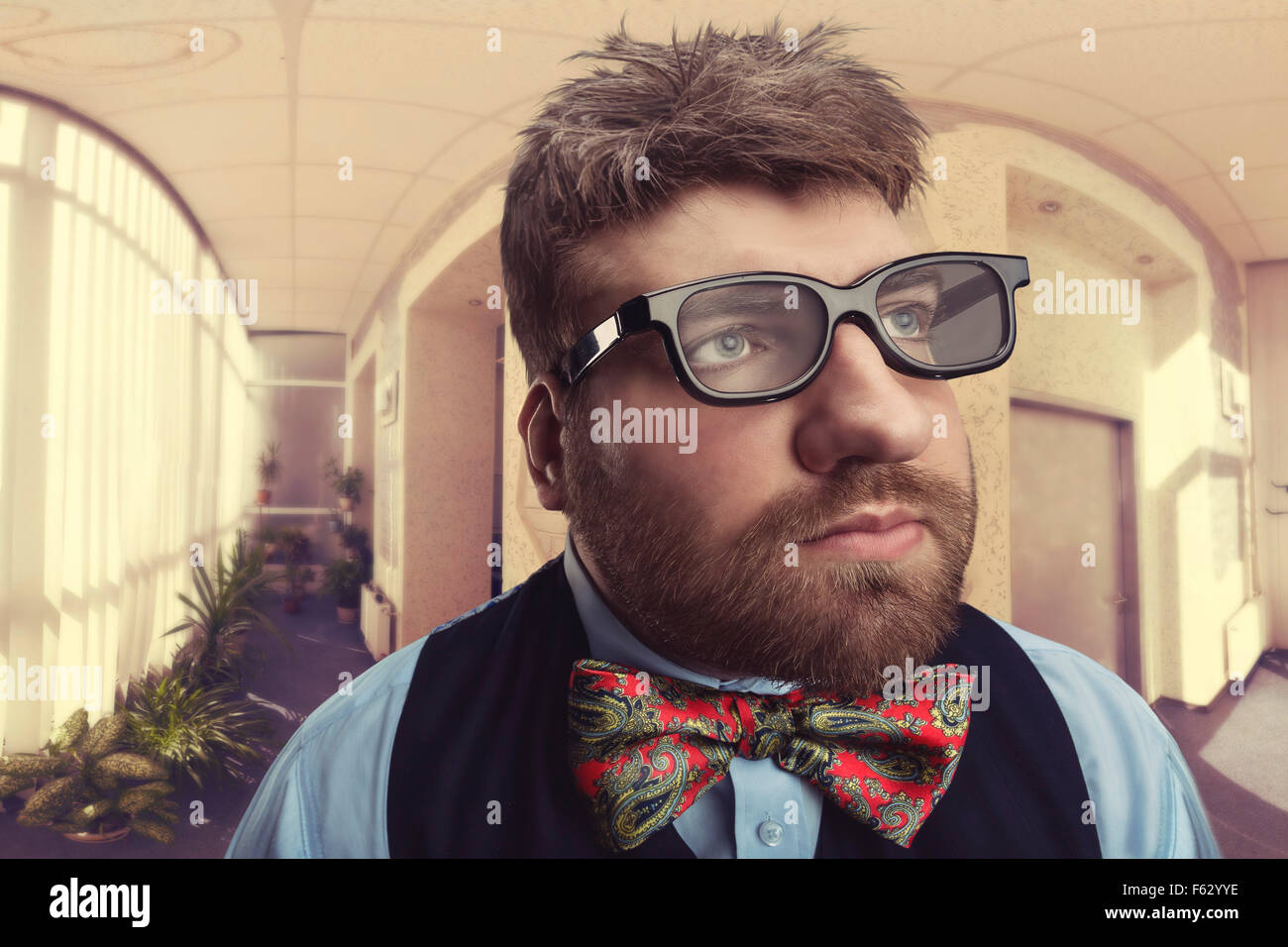 Office nerd in glasses looks aside Stock Photo - Alamy