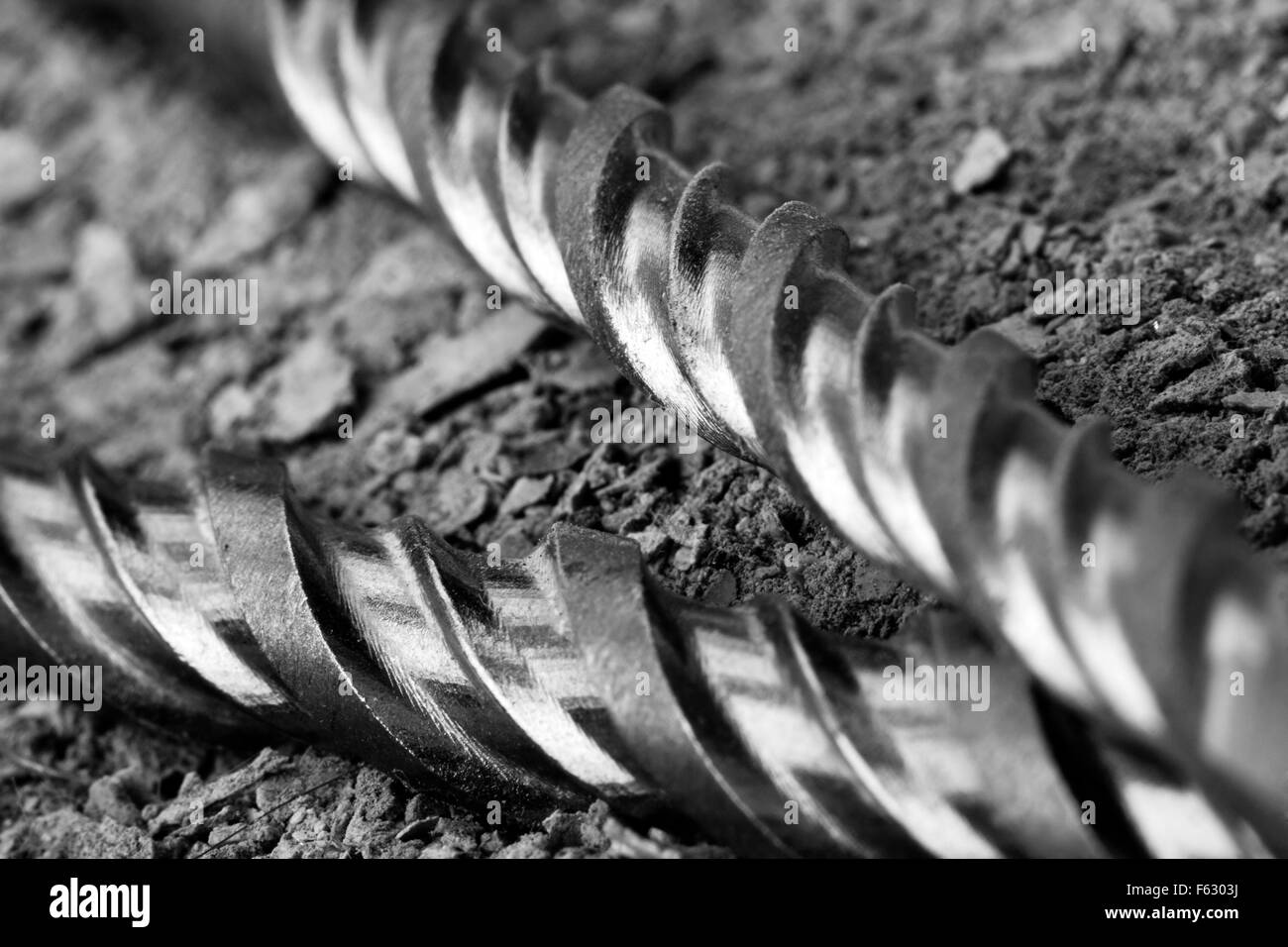 Industrial drills on cracked concrete. Close-up view Stock Photo