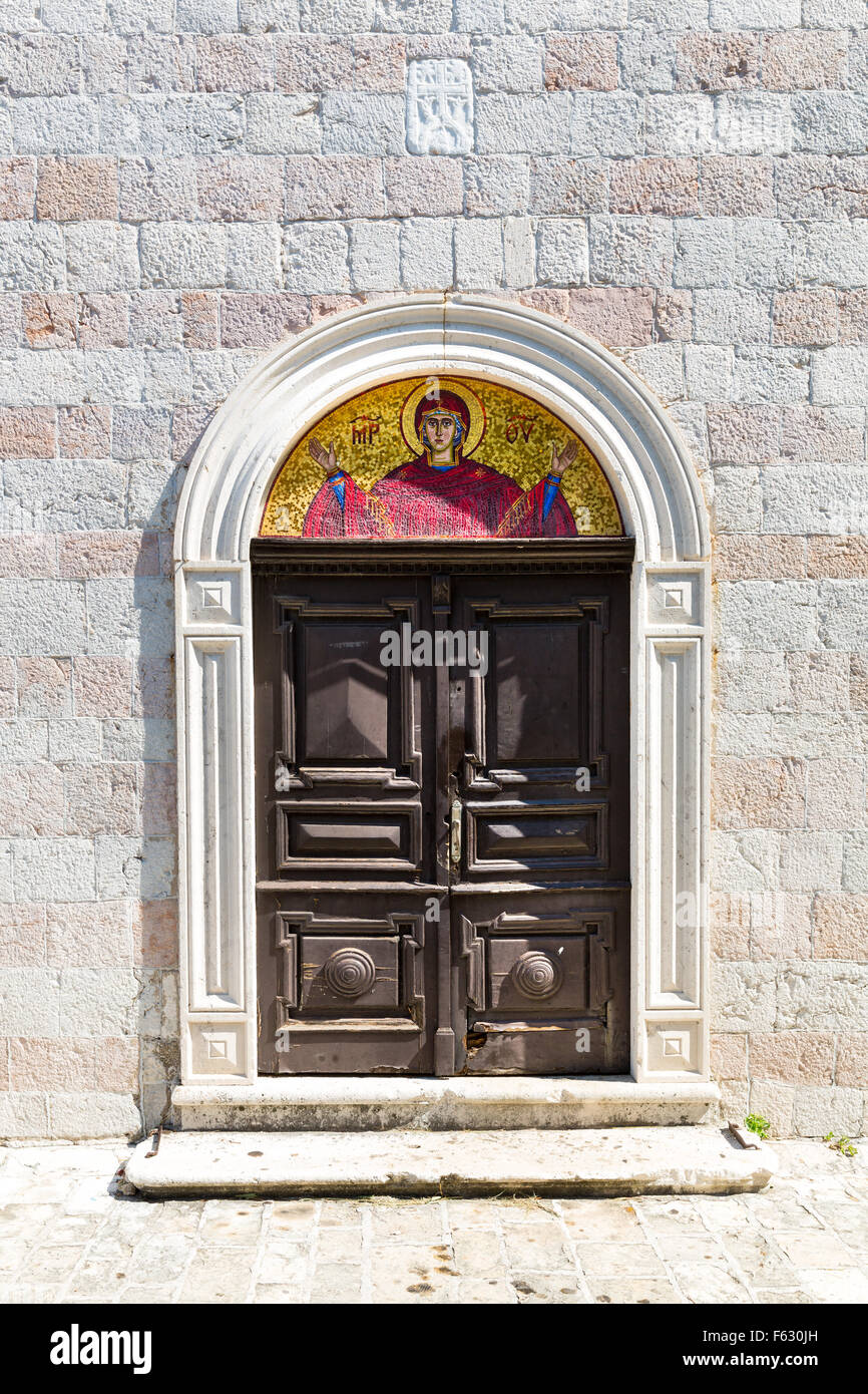 Arched old wooden door in a church stone wall Stock Photo - Alamy