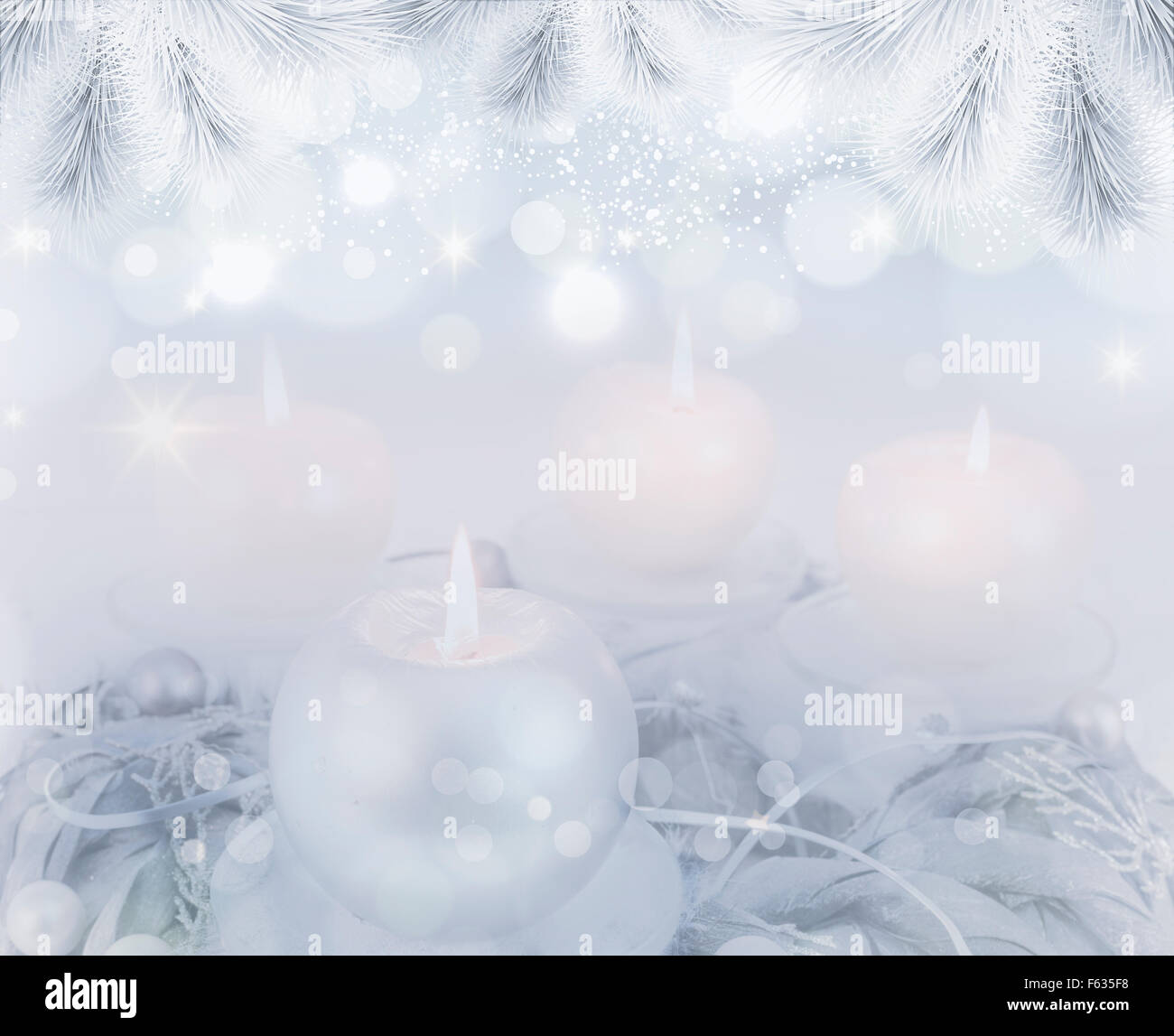 Silver advent wreath with 4 metallic candles on blue backround Stock Photo