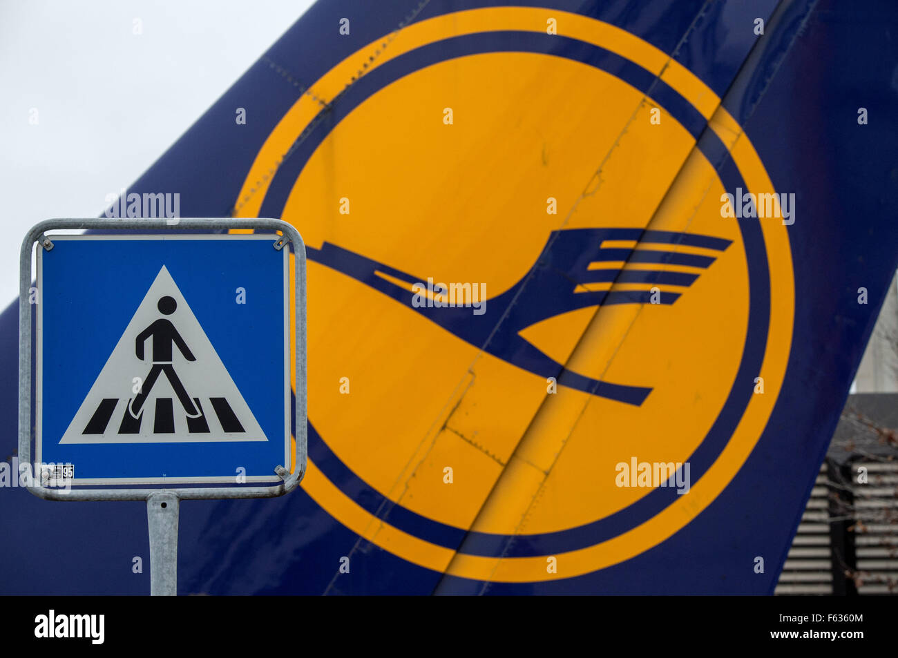 A pedestrian crossing sign can be seen in front of a Lufthansa base at the airport in Frankfurt am Main, Germany, 11 November 2015. Hundreds of flights have been cancelled after a court ruling declared the Independent Flight Attendant Organization (Ufo) strike lawful. Photo: BORIS ROESSLER/dpa Stock Photo
