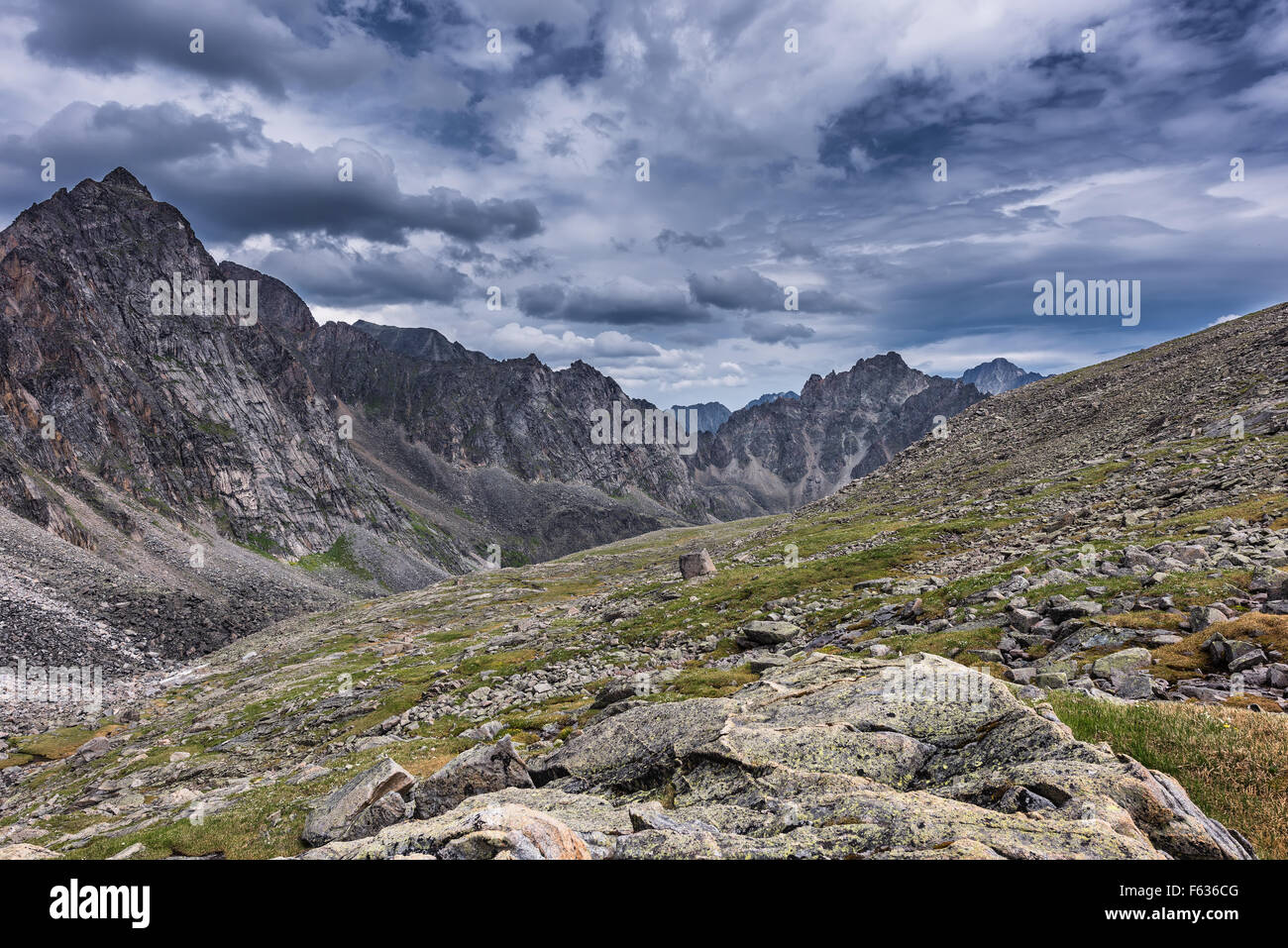 Gloomy skies over the slopes of the mountain tundra, in July. Eastern Sayan.The Republic of Buryatia Stock Photo