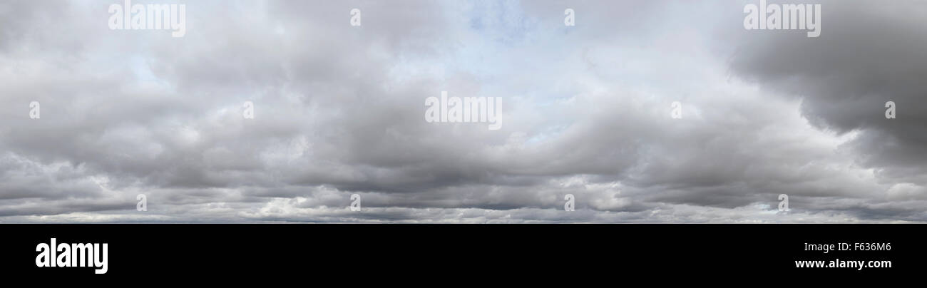 panoramic sky grey clouds with a hint of blue sky in parts Stock Photo