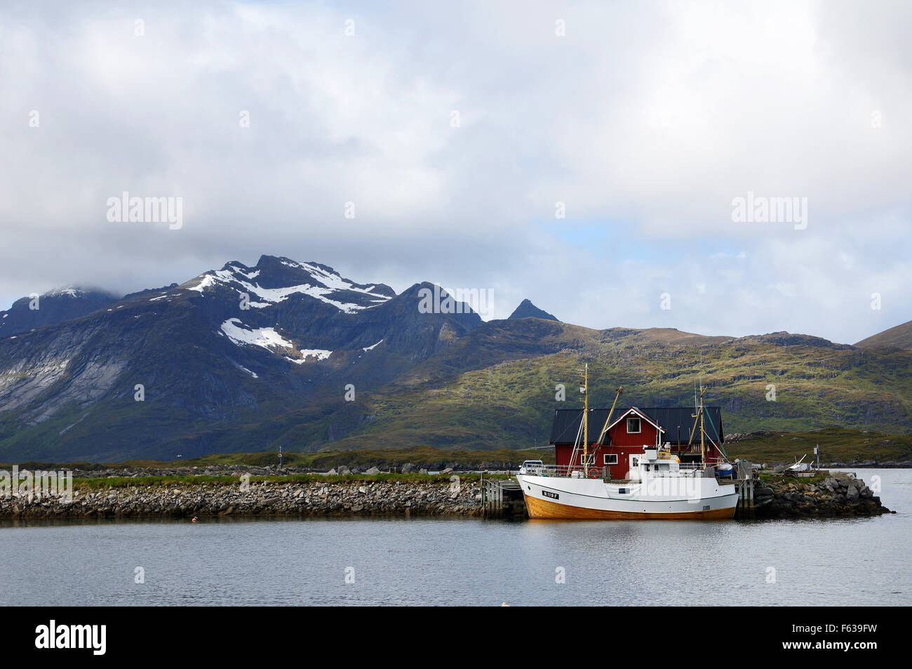 Fishing boat and fisherman's cabin on the Lofoten Islands, Norway. Stock Photo