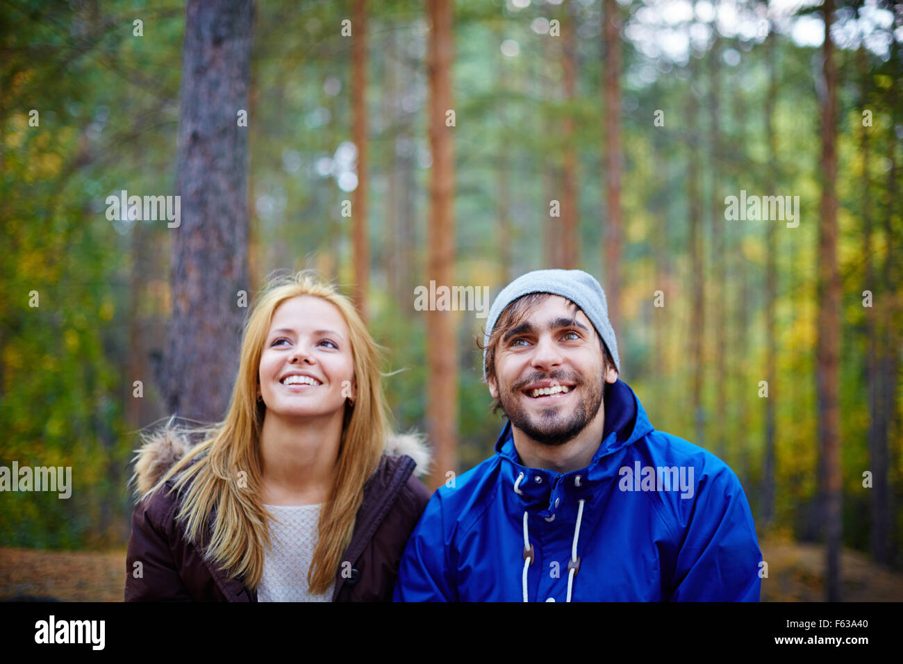 Happy young couple in the forest Stock Photo - Alamy