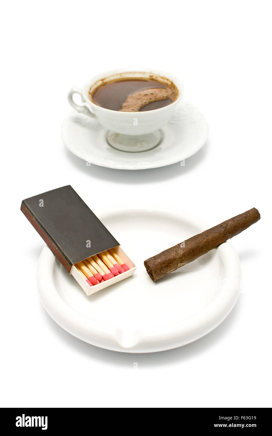 Cigar with matches and cup of coffee on white Stock Photo