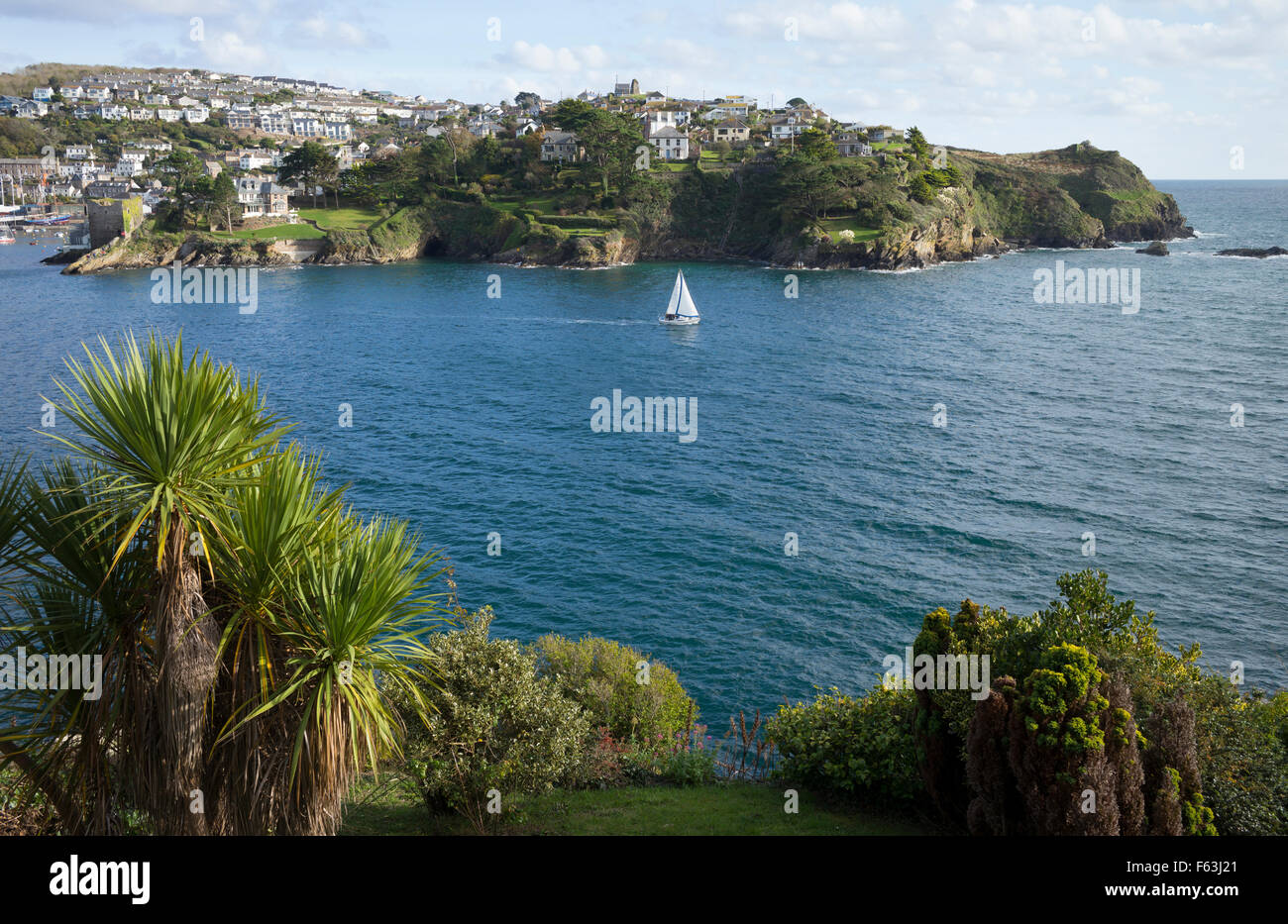 A yacht on the mouth of the River Fowey in Cornwall, UK Stock Photo