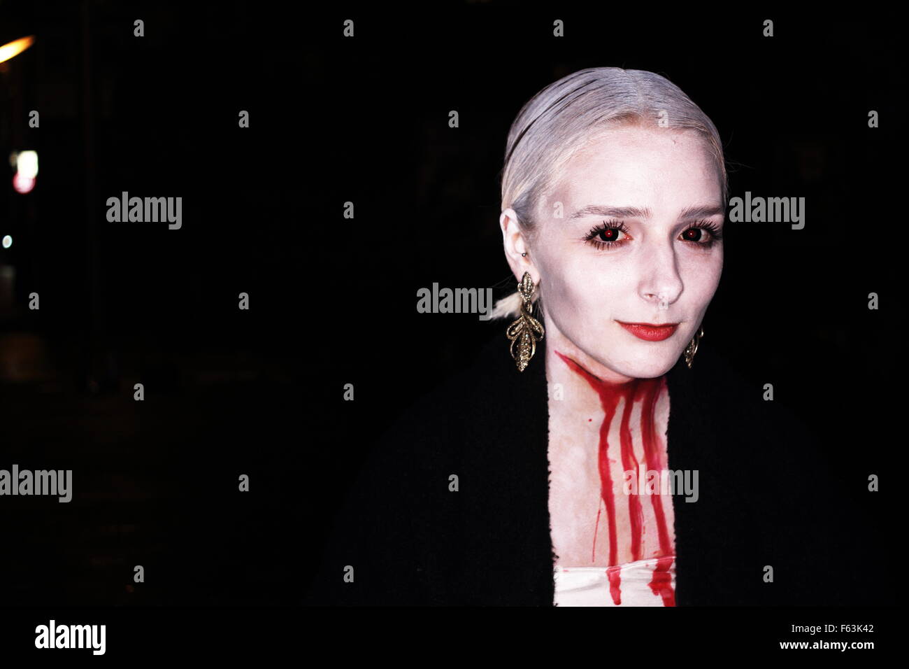 People photographed on the street with their Halloween make up and