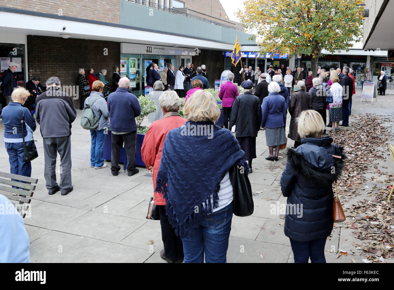 Portishead, Bristol, UK. 11th November, 2015. A two-minute silence was observed across the UK to remember the nation's war dead. Local people gathered in the Portishead town precinct and were joined by those out shopping to commemorate the dead of the two world wars at 11.00am. Credit:  Stephen Hyde/Alamy Live News Stock Photo