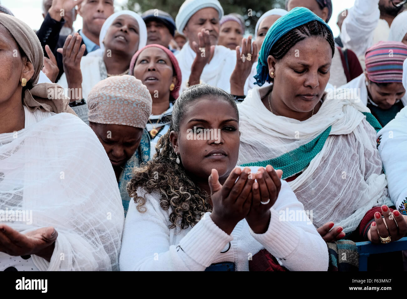 Jerusalem, Israel. 11th Nov, 2015. Jewish Ethiopian women wave their hands and bow in prayers of thanksgiving for delivery to Israel. The Jewish Ethiopian community in Israel, Beta-Israel, celebrated the Sigd, symbolizing their yearning for Jerusalem for thousands of years of exile, at the Haas Promenade overlooking the Temple Mount. Credit:  Nir Alon/Alamy Live News Stock Photo