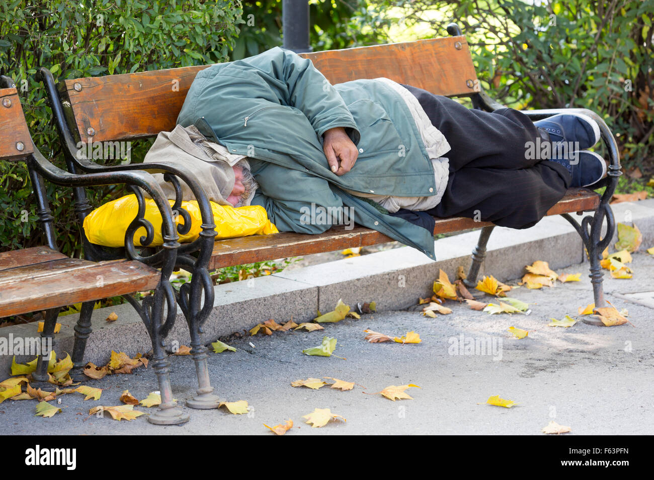 Homeless Person Is Sleeping On A Bench In A Cold Autumn Day In A Park In European Union S Poorest Country Bulgaria Stock Photo Alamy