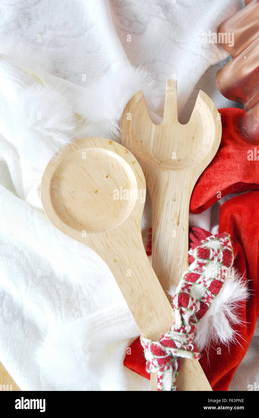 Wooden fork and spoon on Christmas concept background Stock Photo