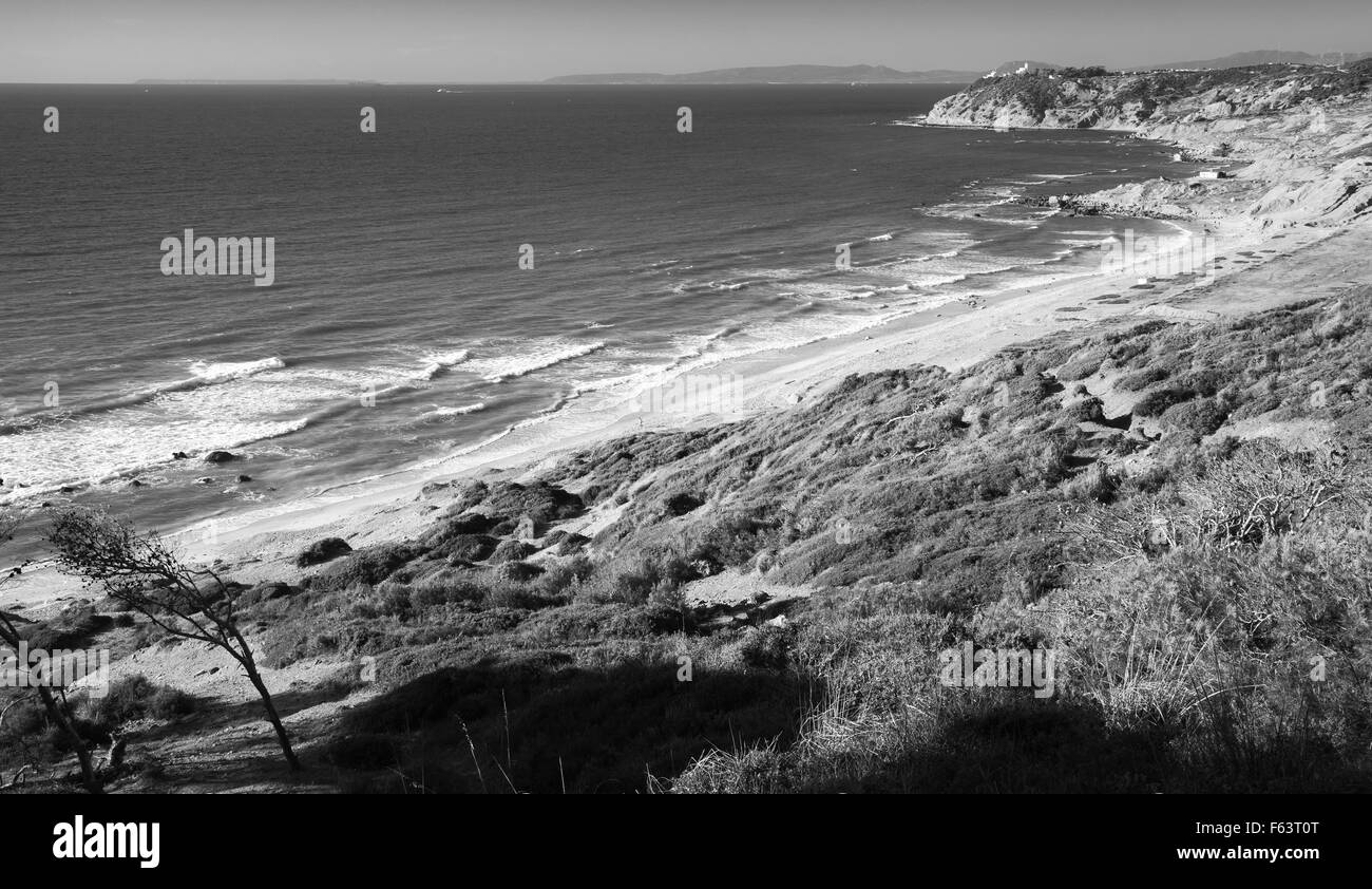 Atlantic Ocean coast in summer. Coastal landscape of Gibraltar strait, Morocco. Black and white photo Stock Photo