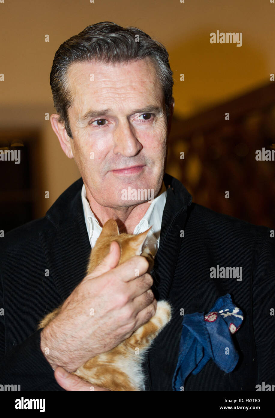 Henndorf, Austria. 10th Nov, 2015. British actor Rupert Everett poses with a dog at the opening of the traditional Christmas events in Gut Aiderbichl animal sancturay in Henndorf, Austria 10 November 2015. On 5 December 2015 at 8:15pm a program 'Advent auf Aiderbichl' will be televised on broadcaster ORF 2 and 'tierisch, tierisch' (lt: beastly, beastly) will air pn the 23 and 30 Decemeber 2015 at 7:50pm, reporting from the Christmas events. At the sanctuary animals are taken in who have had a sad history. © dpa picture alliance/Alamy Live News Stock Photo