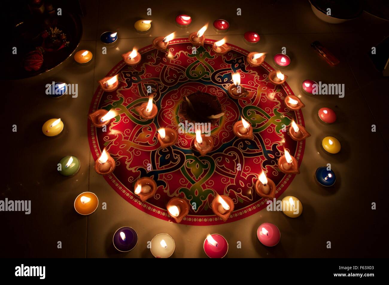 Beautiful rangoli with colorful candle and diyas for Diwali pooja hindu festival Stock Photo