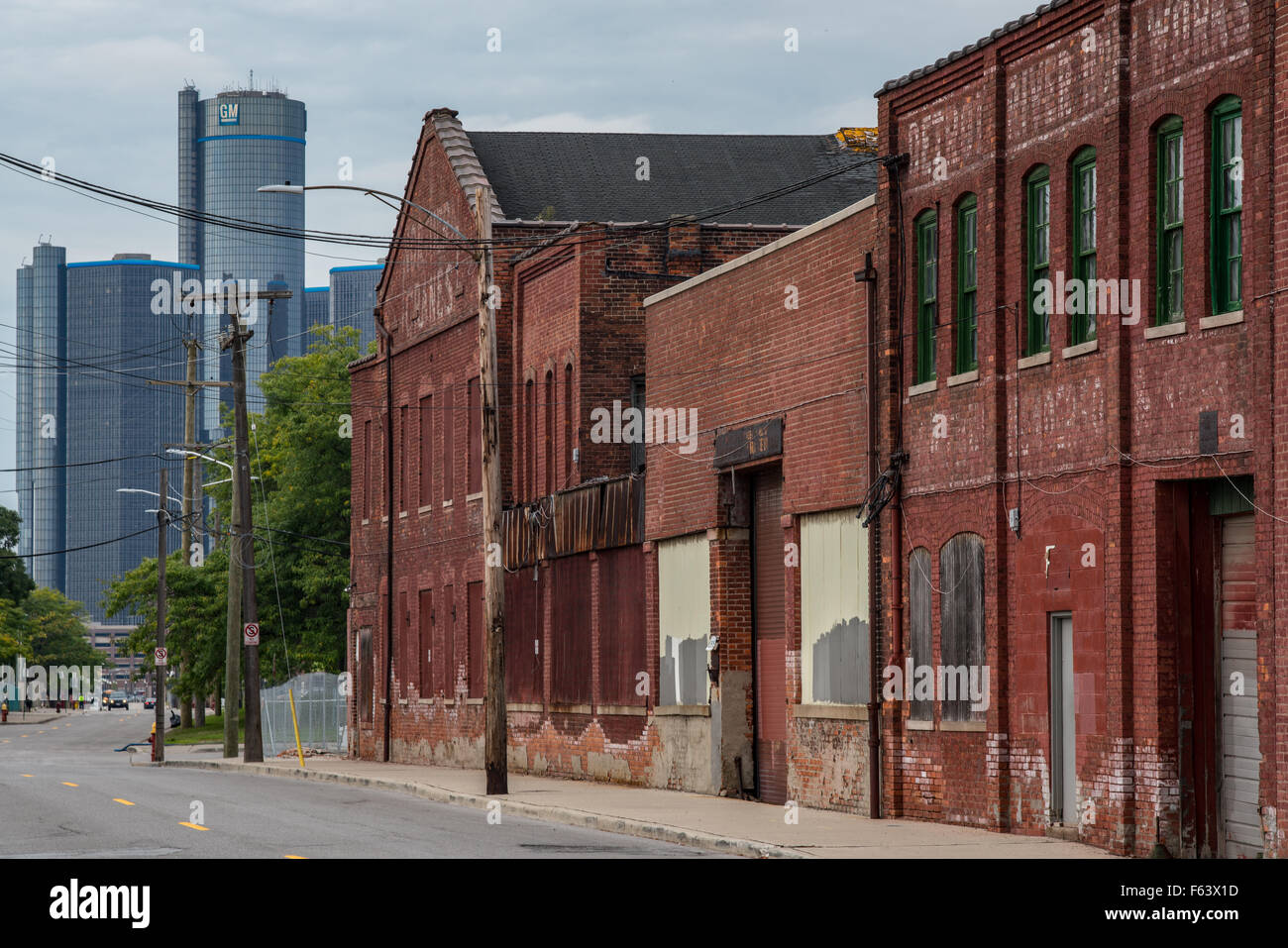 Detroit, MI, USA – Sept 18, 2015.  Boarded up brick industrial buildings along Atwater Street in Detroit. Stock Photo