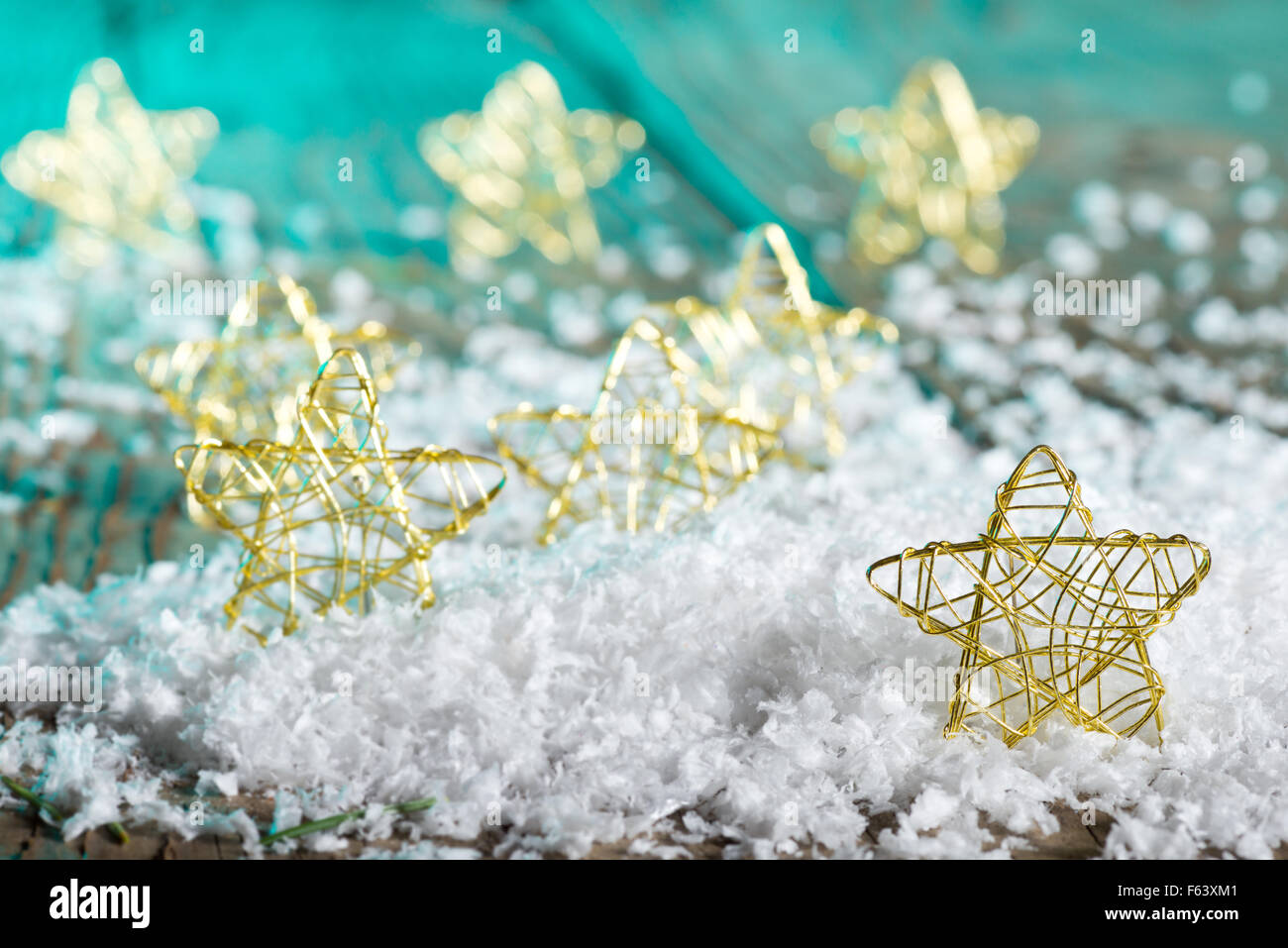 Christmas stars in the snow on the green background Stock Photo - Alamy