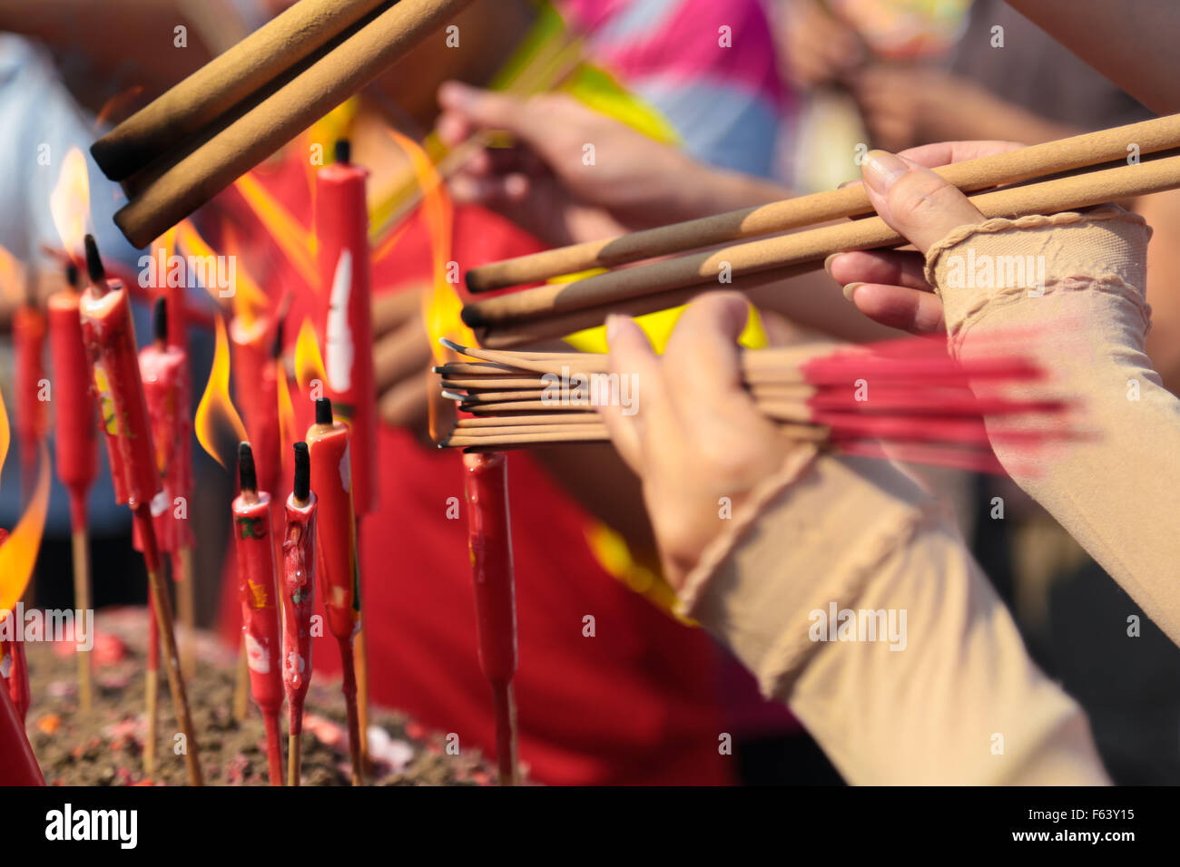 Chinese people lighting up joss sticks at Kwong Tong cemetary, Kuala