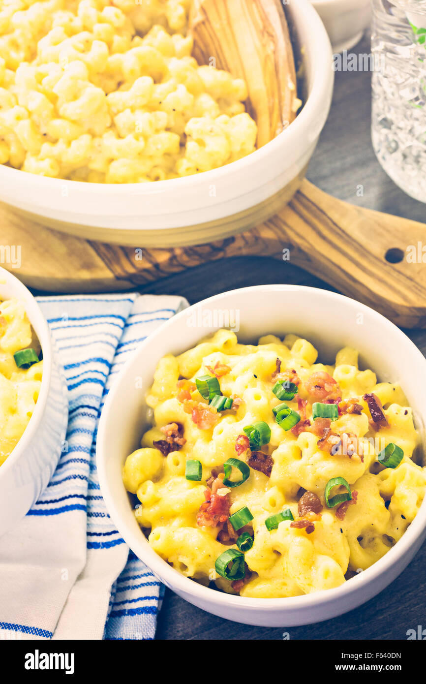 Macaroni and cheese garnished with bacon bits and chives Stock Photo
