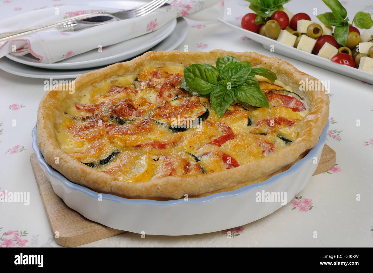 Quiche with zucchini (green, yellow) and tomatoes baked cheese Stock Photo