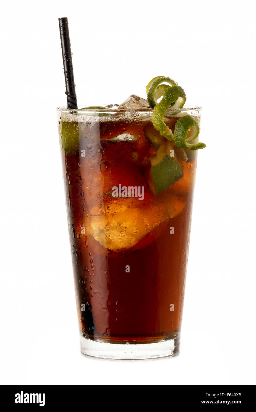 Big Cuba libre rum cocktail with lime isolated on white background