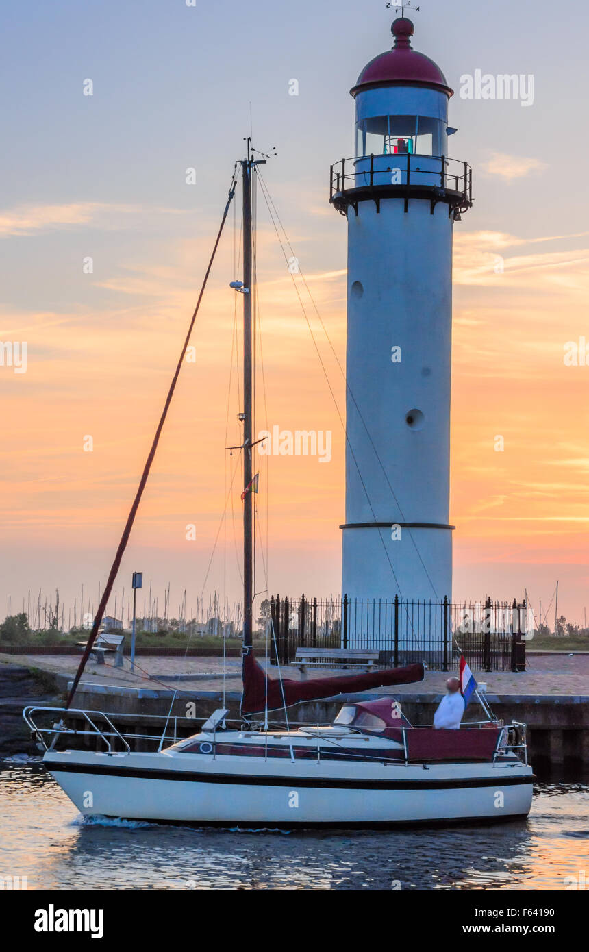 Boat and lighthouse Stock Photo Alamy