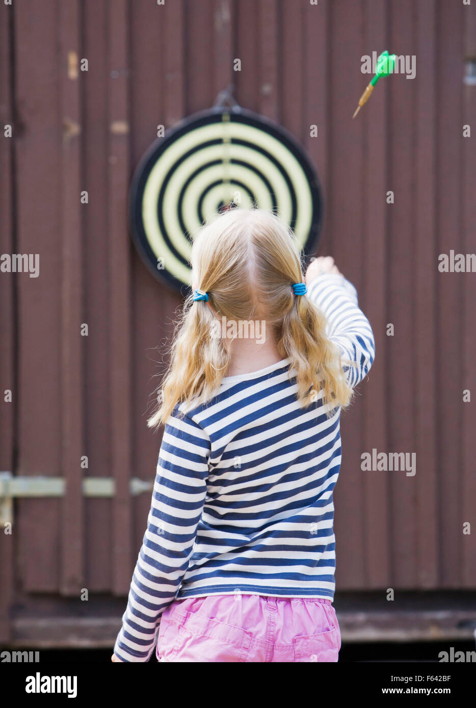 Girl playing dart Stock Photo Alamy