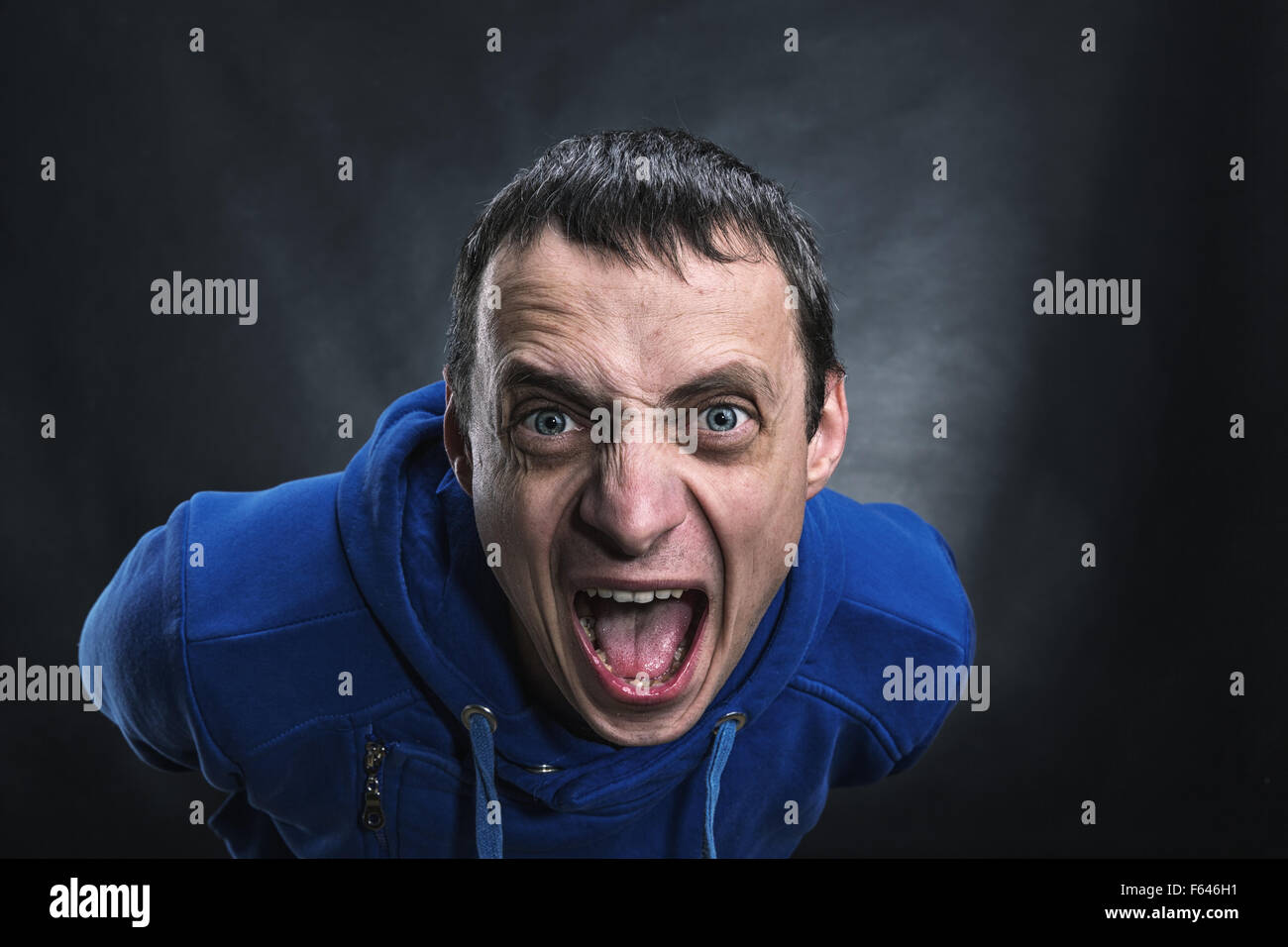 Agressive man's face in the dark Stock Photo