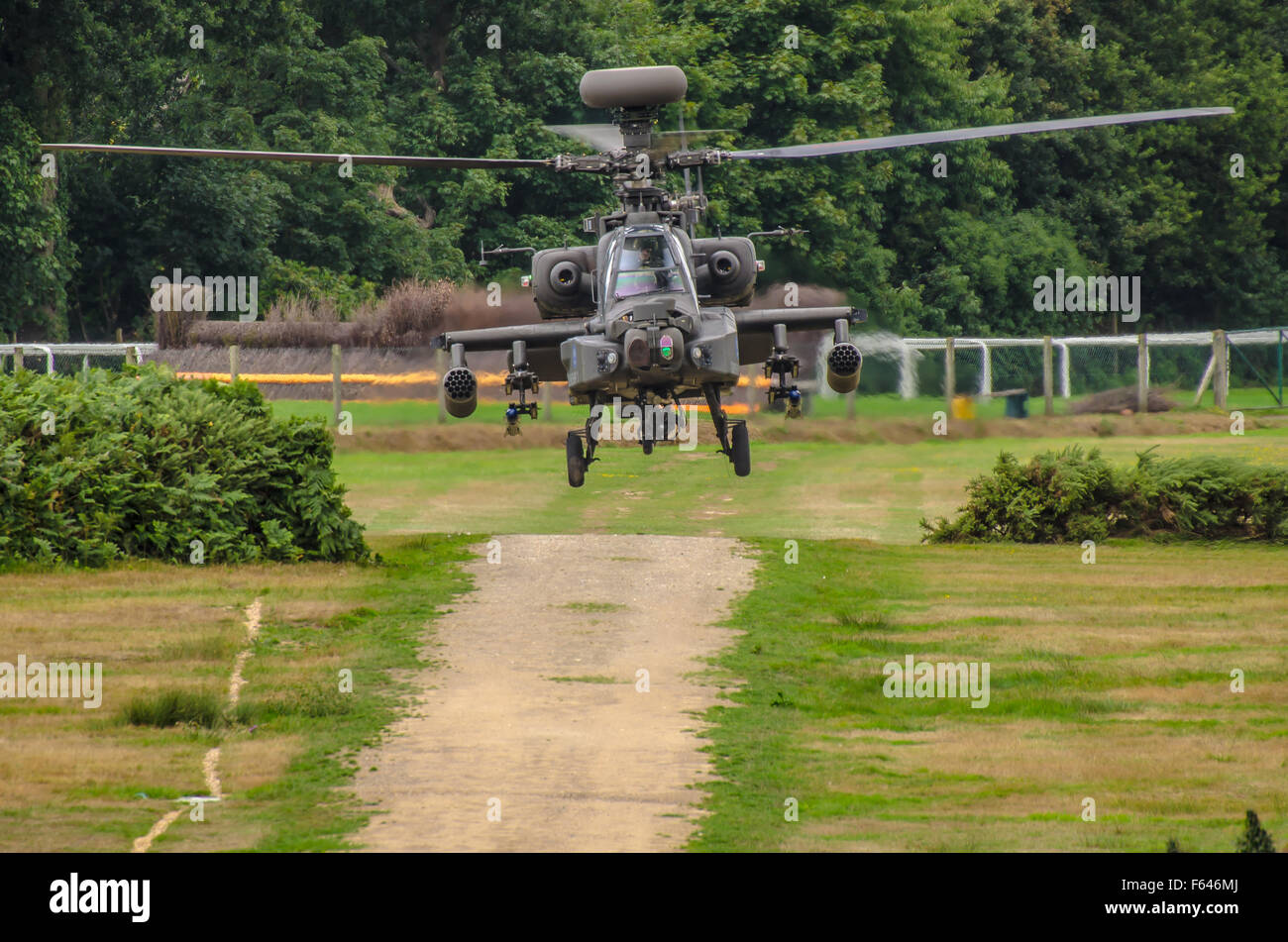 AgustaWestland Apache is a licence-built version of the AH-64D Apache Longbow attack helicopter for the British Army. Landing at Ascot racecourse Stock Photo