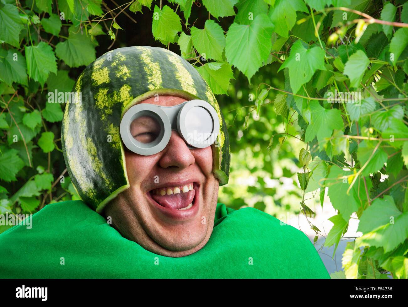 Funny man with watermelon helmet and googles looks like a parasitic caterpillar Stock Photo
