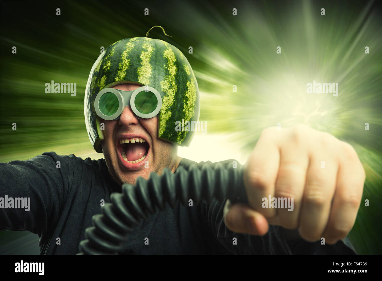 Bizarre man in a helmet from a watermelon riding fast Stock Photo