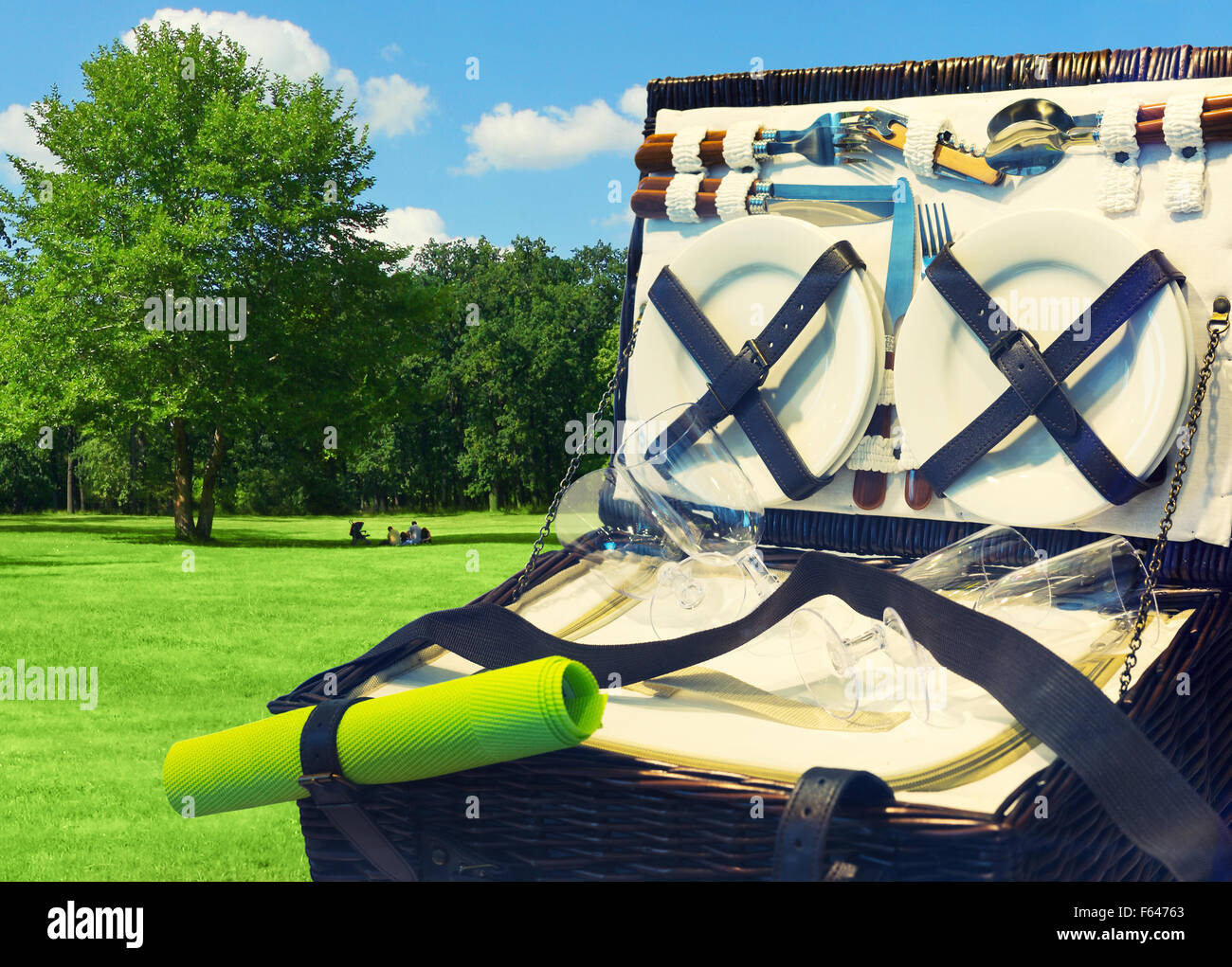 Open picnic basket in the park Stock Photo Alamy