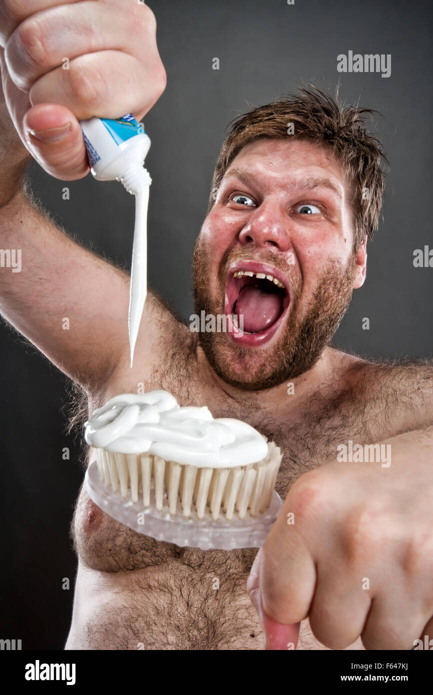 Ugly man preparing to brushing teeth Stock Photo