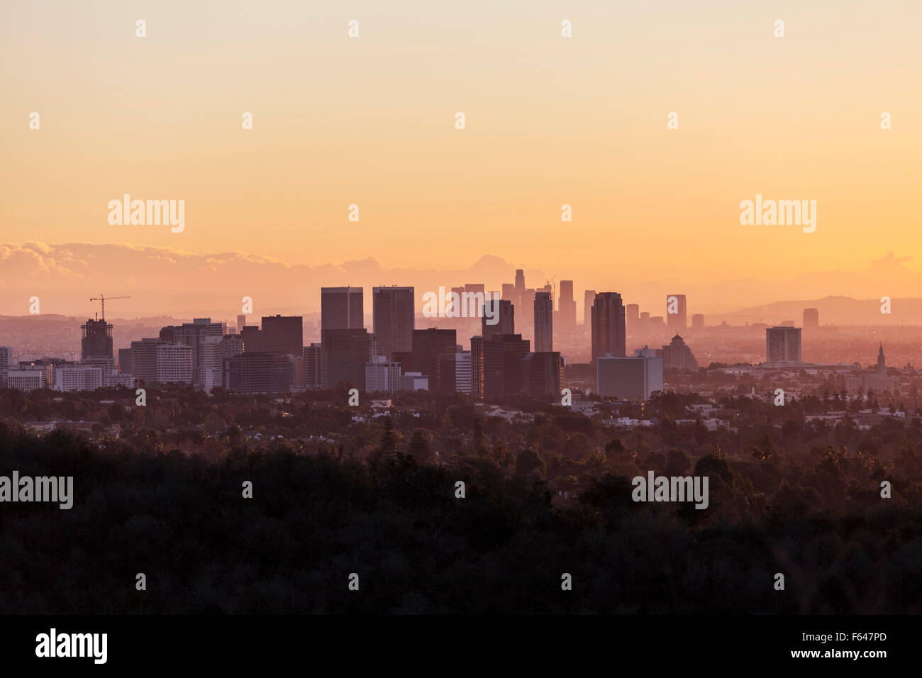 Warm dawn light on Century City and Beverly Hills with downtown Los Angeles in the background. Stock Photo