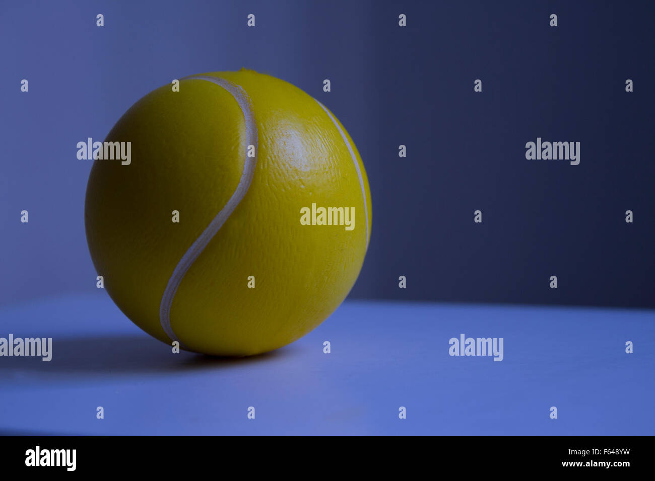 Tennis Ball with blue background Stock Photo - Alamy