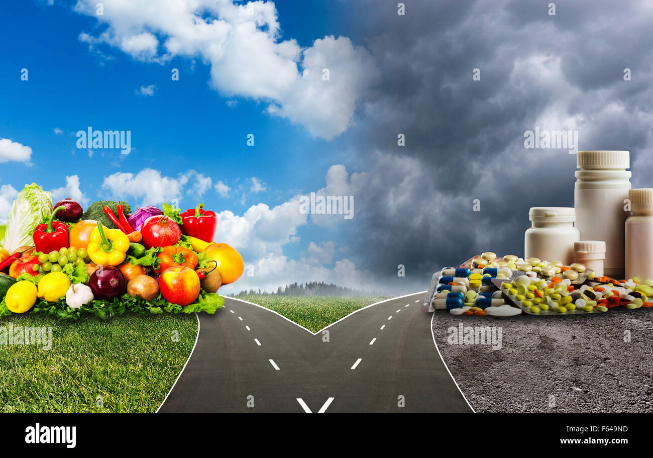 Nutrition choices dilemma between healthy food or medical pills Stock Photo