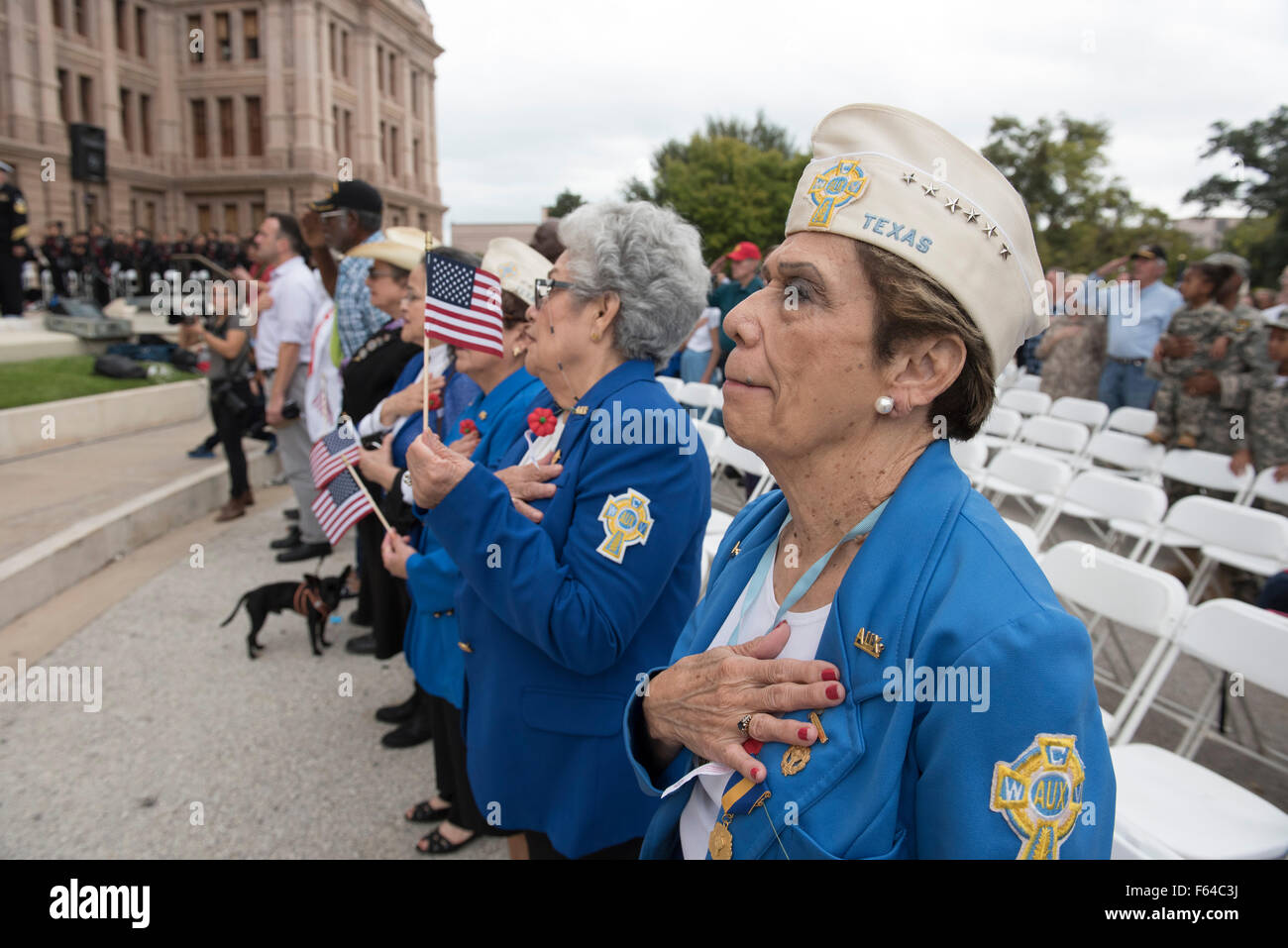 Austin, Texas USA November 11, 2015: Catholic War Veterans Auxiliary members pay their respects  during the Veteran's Day parade up Congress Avenue and ceremony at the Texas Capitol. Several thousand Texans lined Congress Avenue to witness military heroes, marching bands and floats in the annual parade. Credit:  Bob Daemmrich/Alamy Live News Stock Photo