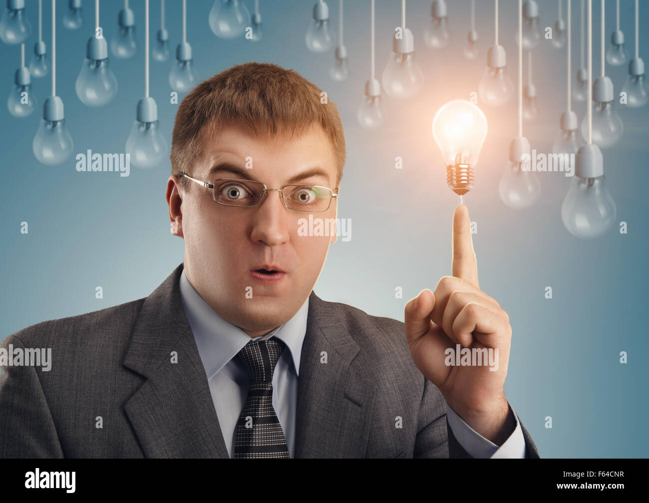 Business consept, business man turn on lamp Stock Photo