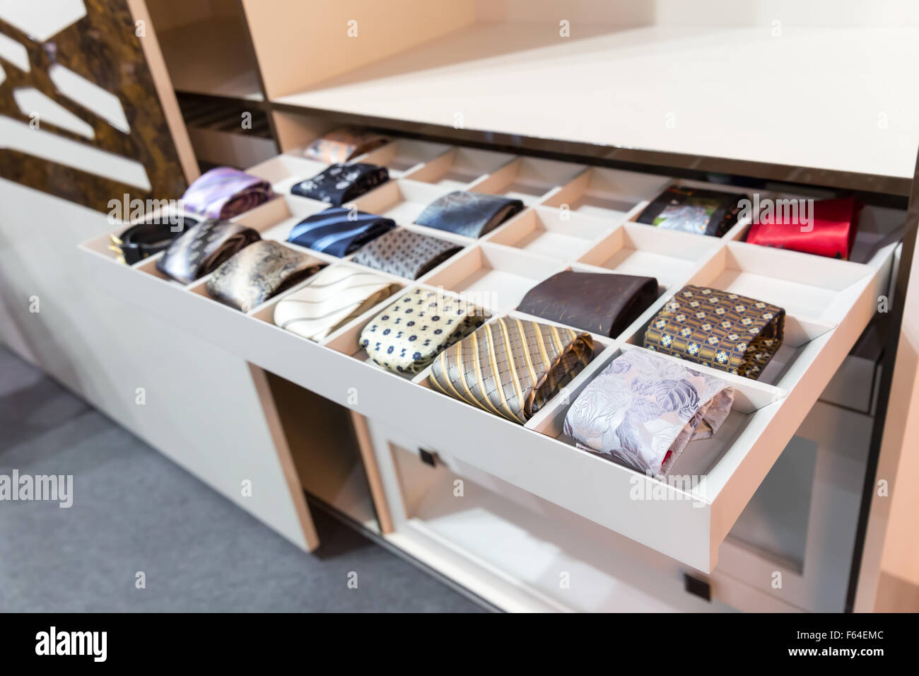 Many modern ties in wardrobe Stock Photo - Alamy