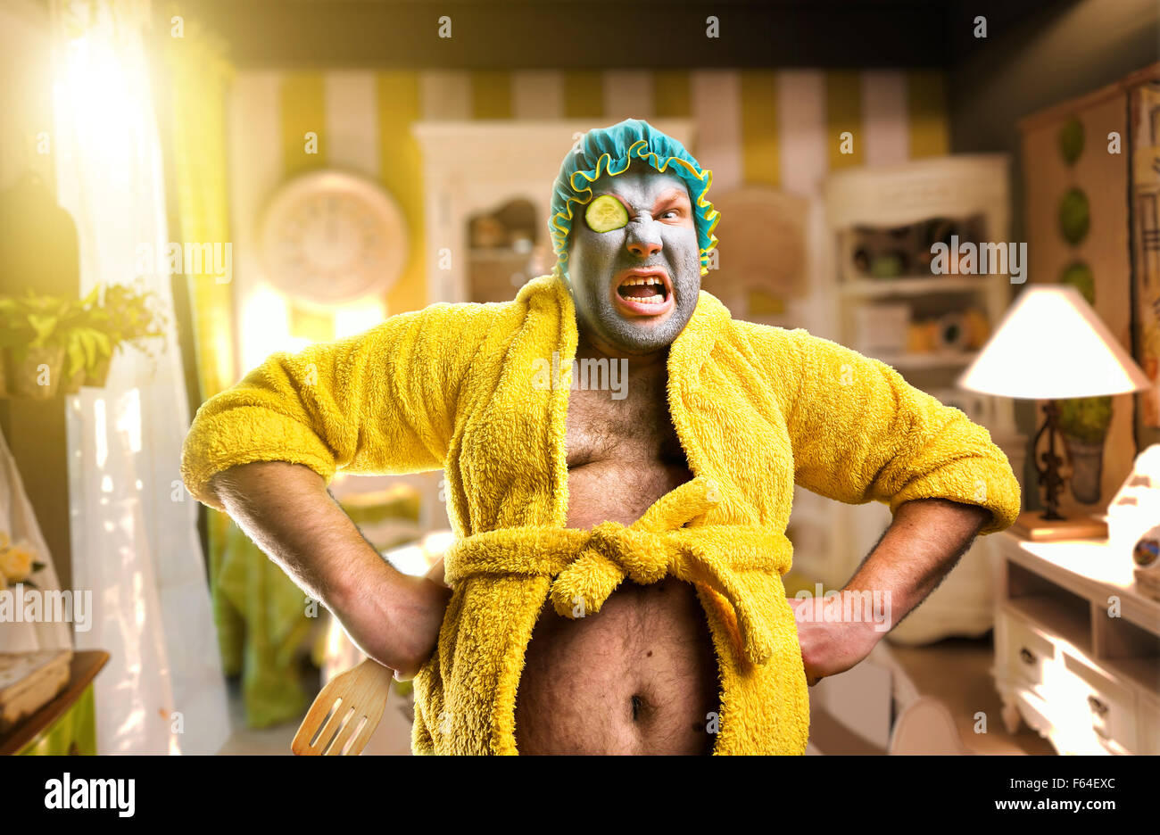 Angry freak man with face pack in cosy interior Stock Photo