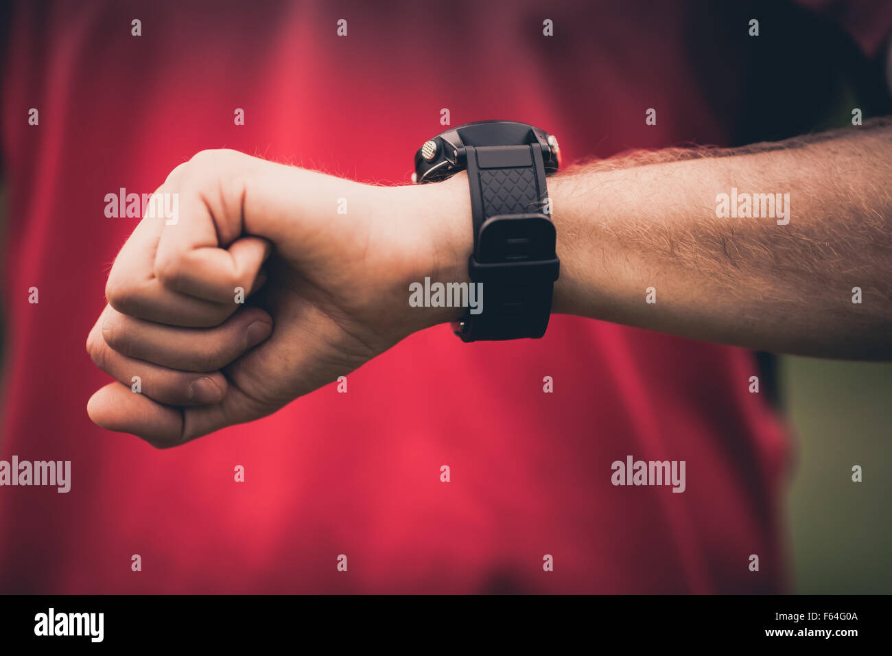 Runner using heart rate monitor training running, smartwatch checking