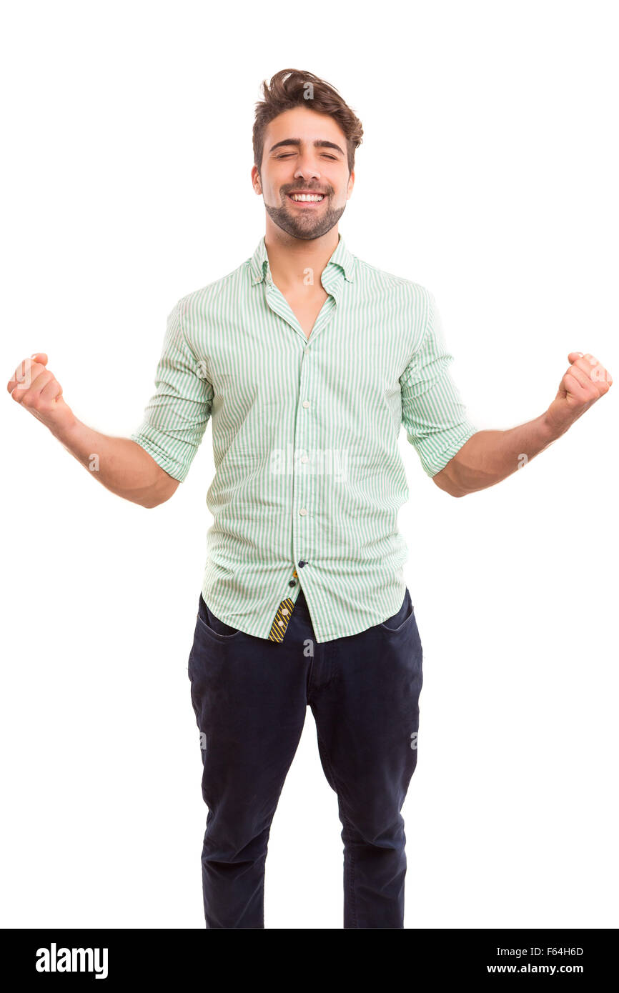 Happy young man celebrating with arms open Stock Photo - Alamy