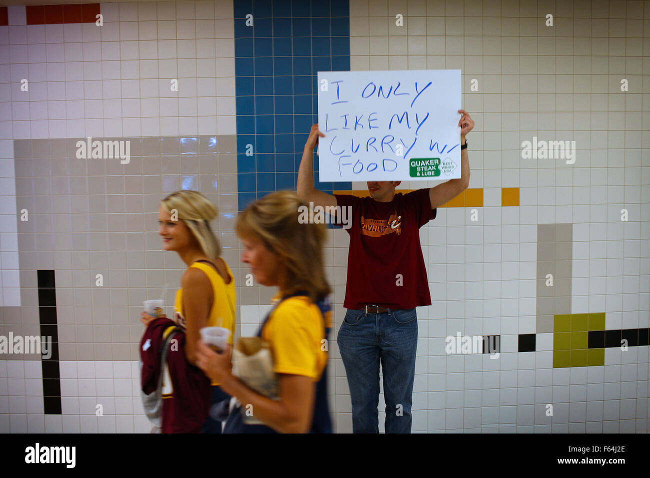 Cleveland, Ohio, USA. 9th June, 2015. Cleveland, Ohio June 9, 2015: John Hoover hold up a ''I only like curry in my food'' sign as to Golden State fans walk by. This was hoovers first Cavs game ever and he drove from his home town of Erie Pennysylvania to attend. (Michael F. McElroy © Michael F. Mcelroy/ZUMA Wire/Alamy Live News Stock Photo