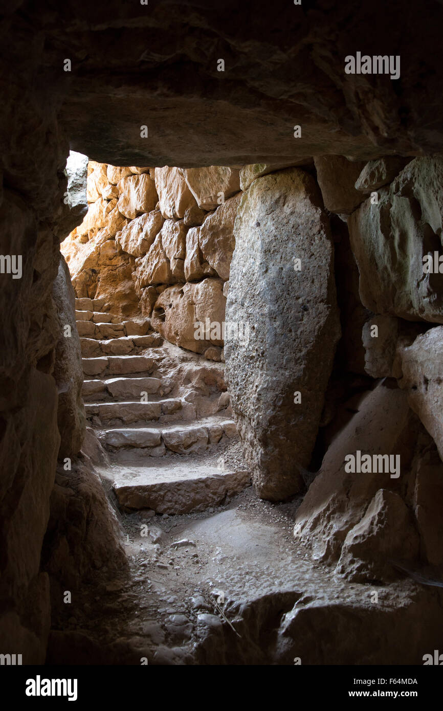 Steps leading up from the subterranean cistern at the historic site of Mycenae, Greece Stock Photo